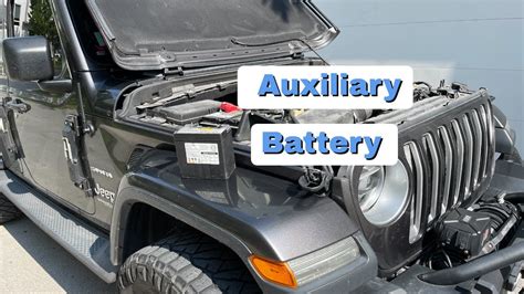 The "thinner" black cable is the aux battery ground. . How to charge auxiliary battery jeep